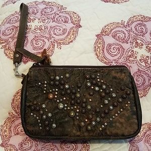 Genuine leather wristlet with awesome metal detail